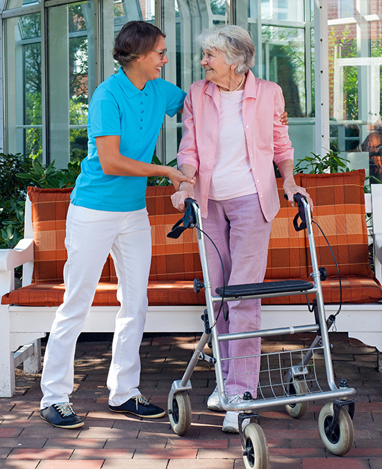 woman helping another woman walk